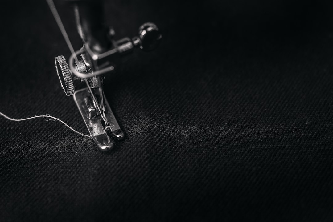 10 Essential Clothing Alterations Explained | Online Alterations & Tailor Guide 5 A back and white top down photo of a sewing machine